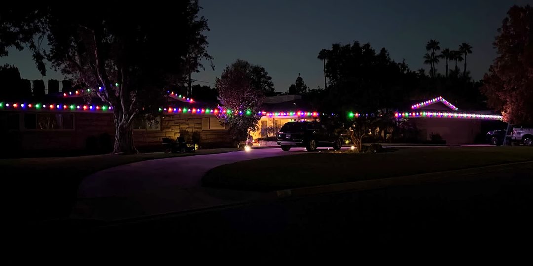 A street of multicolor rooflines at dusk